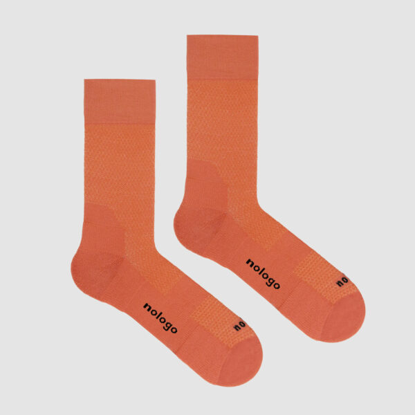nologo gravel cycling socks in vibrant orange: ideal for rugged off-road trails