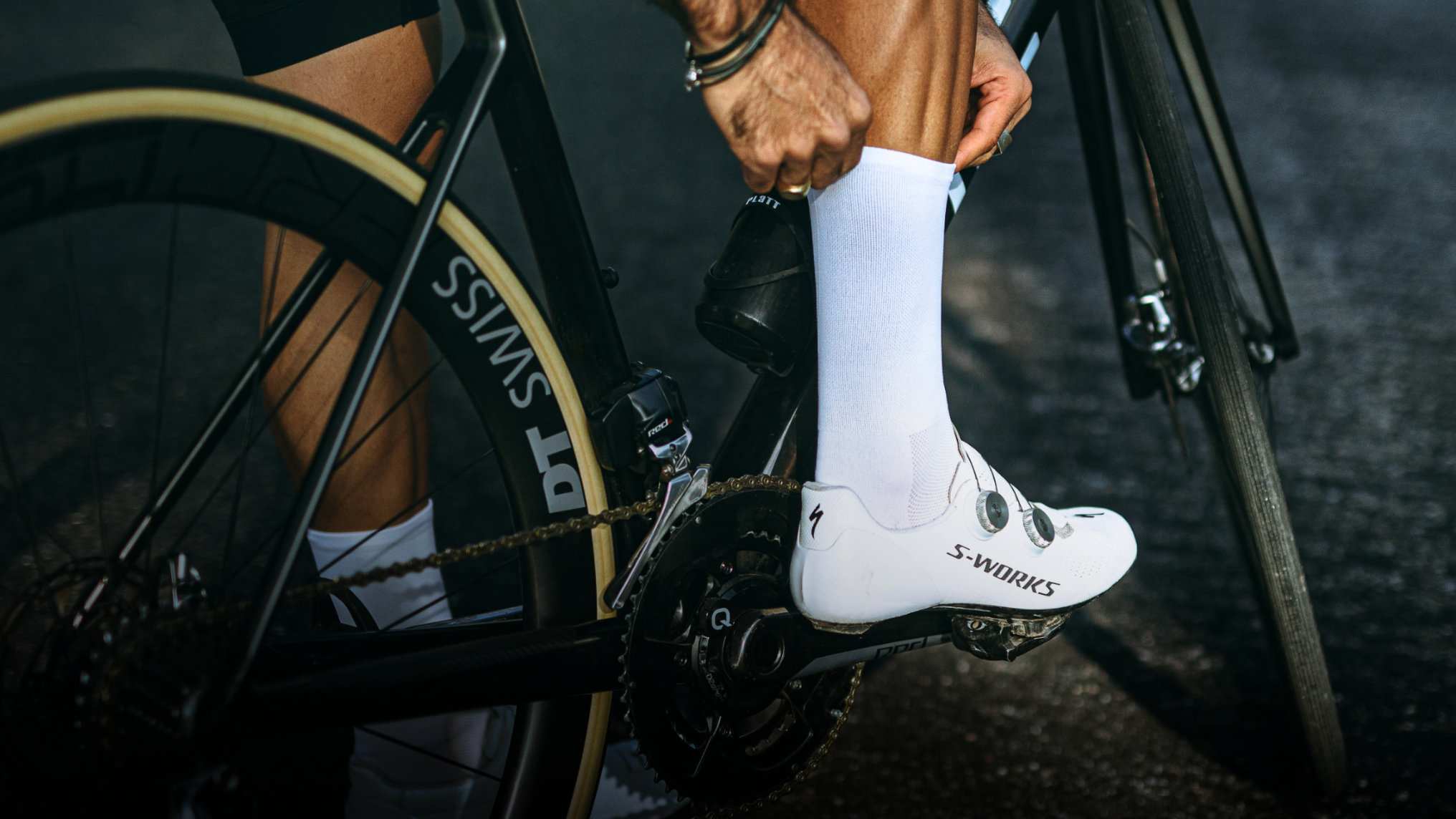 Nologo’s best-selling white cycling socks on display, highlighting their sleek, minimalist design and premium materials, perfect for enhancing both comfort and visibility on the road.